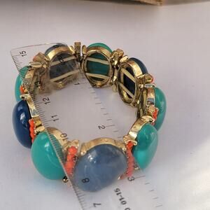 Vintage colorful stretch bracelet with blue cabochons and orange beads
